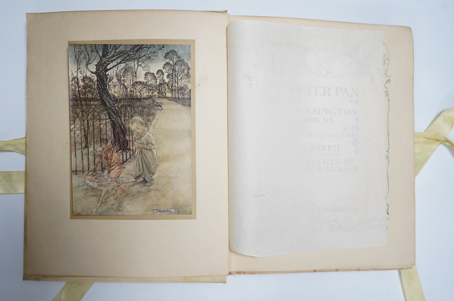 Barrie, J.M. - Peter Pan in Kensington Gardens, illustrated by Arthur Rackham, including 50 tipped-in colour plates, captioned tissue guards, pictorial endpapers, 4to, original vellum pictorially gilt, top edge gilt, rib